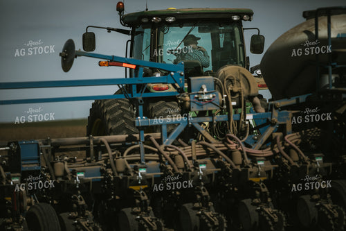 Farmer in Tractor Cab with Planter 4147