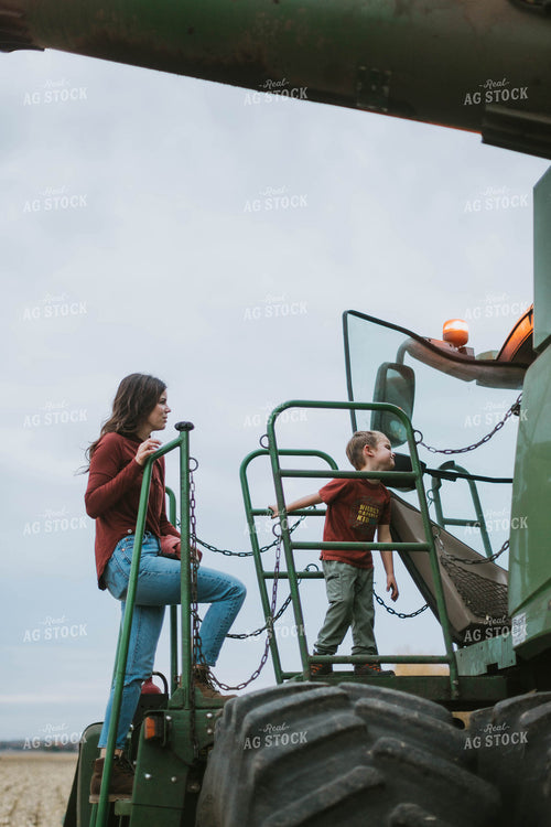 Farm Family Loading Kids into Combine 8629