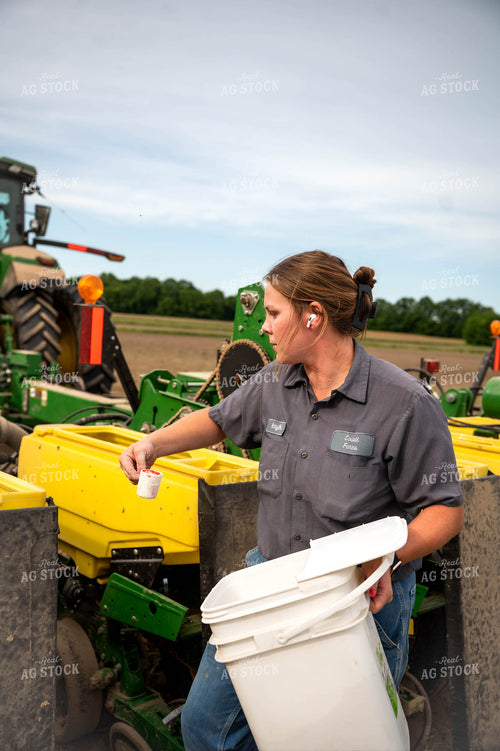Female Farmer Filling Planter 115642