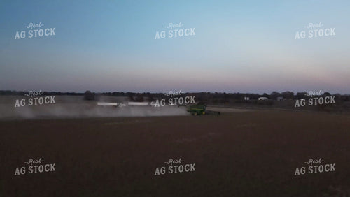 Aerial of Soybean Harvest with Trucks and Combine at Sunset 7381