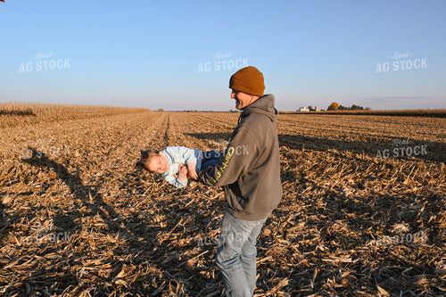 Farmer Holding Kid 26321