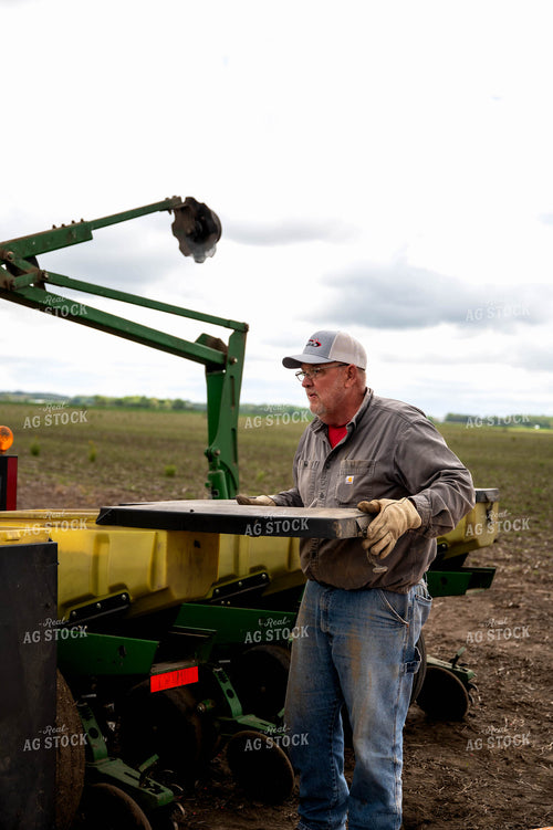 Farmer Filling Planter 115768
