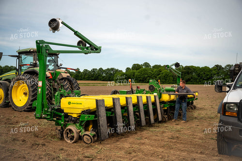 Female Farmer Filling Planter 115645