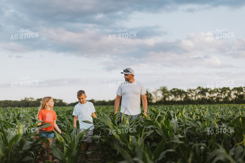 Farmer and Kids Checking Corn 8795