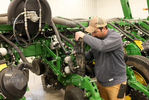 Farmer Fixing Planter 161117