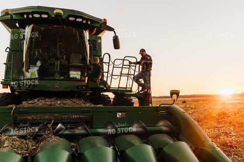 Farm Family Climbing into Tractor 115138