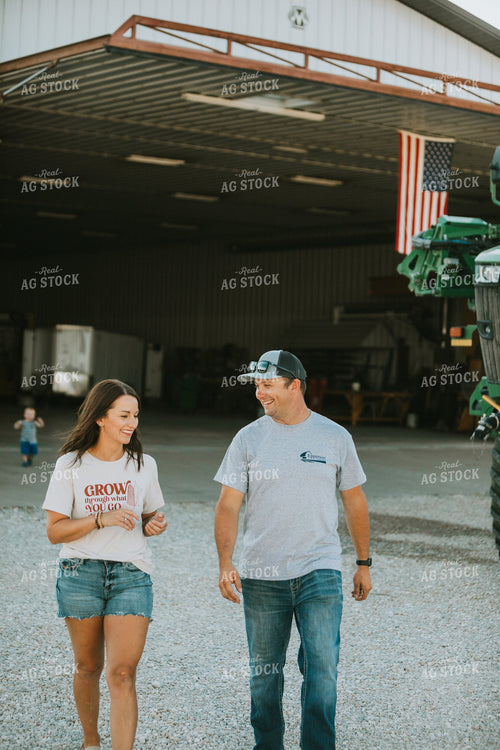 Farmer and Farm Wife Talking Outside Shop 6244