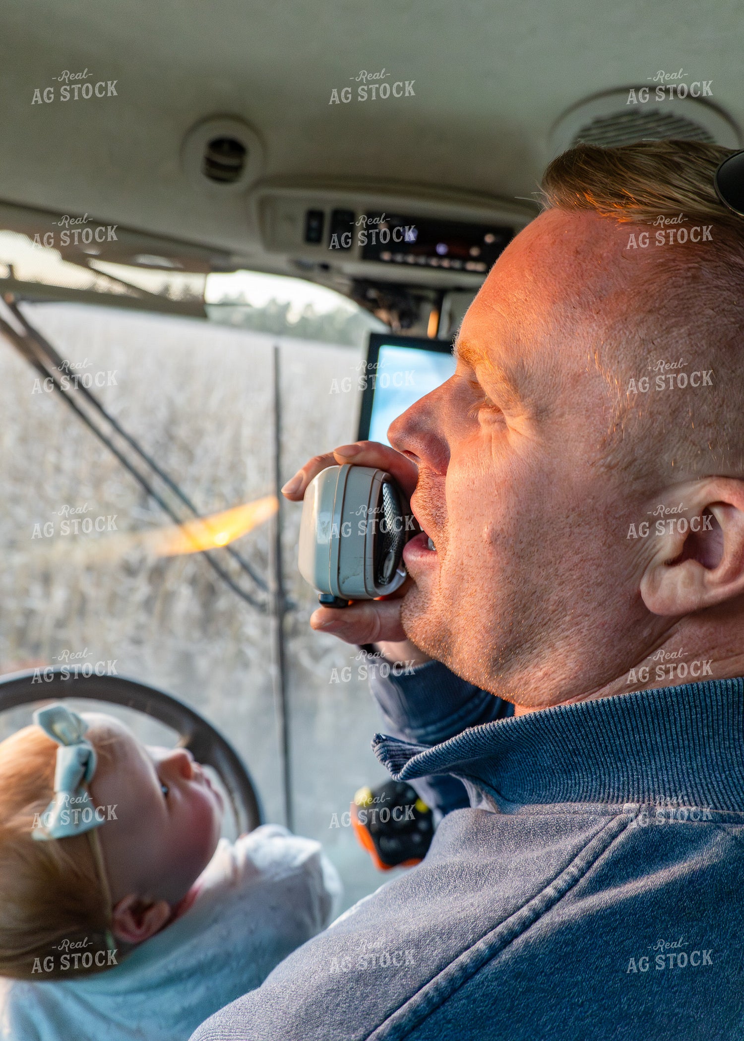 Farm Kid with Farmer in Combine 65504
