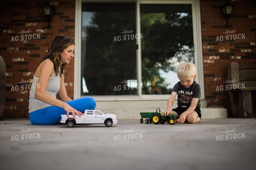 Woman and Farm Kid Playing with Toys 5949