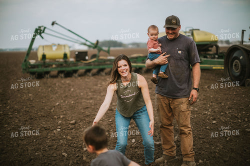 Farm Family in Field During Planting 5647