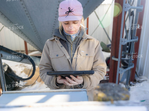 Rancher Looking at Tablet 70210