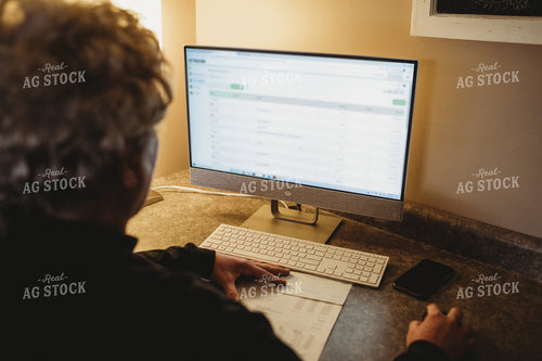 Farmer Using Computer for Farm Accounting 3701