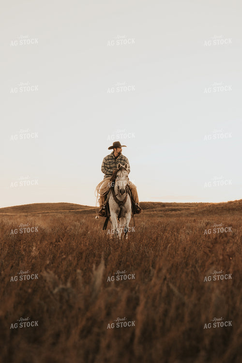Cowboy Riding Horse 61208