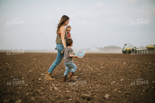 Farm Mom Taking Kids Out to Tractor During Planting 5634