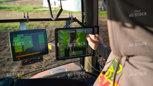 Farmer in the Tractor Cab with Technology 25183