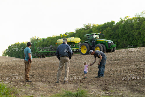 Farm Family Talks by Planter in Field 93258