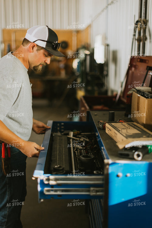 Farmer Looking in Tool Box 7741