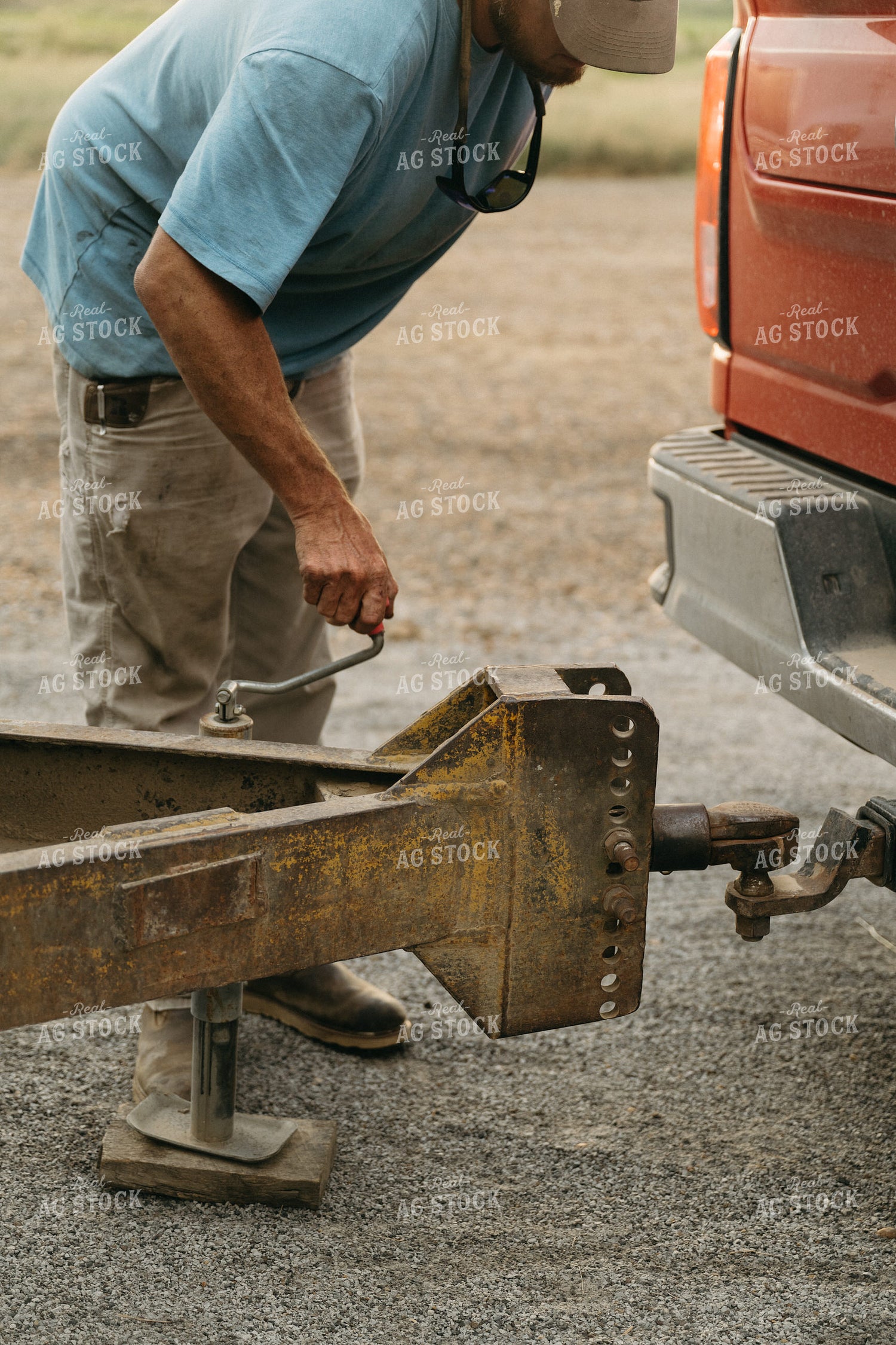 Farmer Hooking Up Trailer 125272