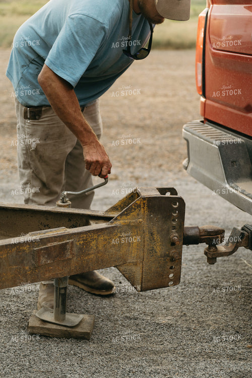 Farmer Hooking Up Trailer 125272