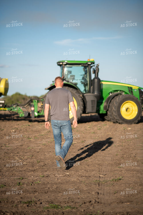Farmer Walking Towards Tractor 76374