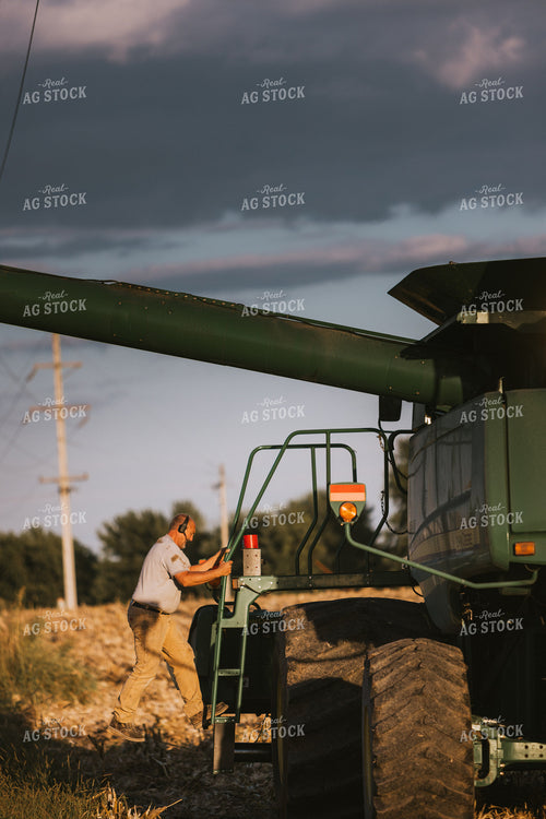 Farmer Climbing into Combine 9377