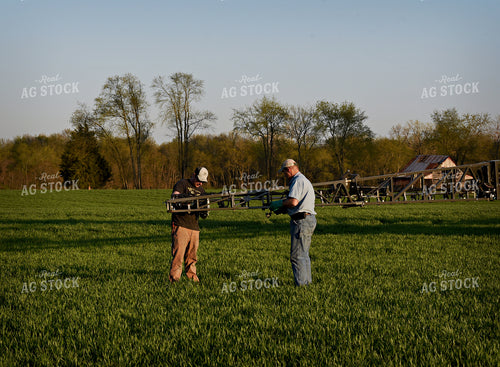Farmer by Sprayer in Wheat Field 100022
