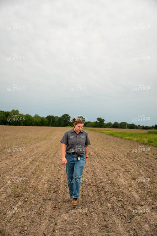 Female Farmer Walking in Field 115722