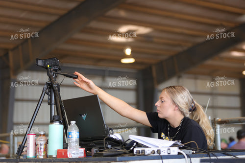 Woman Shooting Video at Stock Show 52454