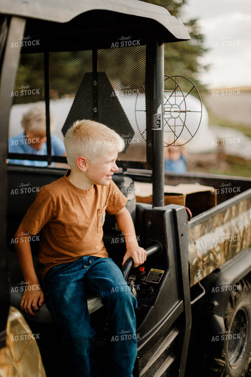 Farm Kids Riding in Side by Side 9354