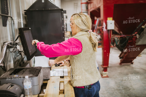 Man and Woman Running Seed Treater with Computer 5325