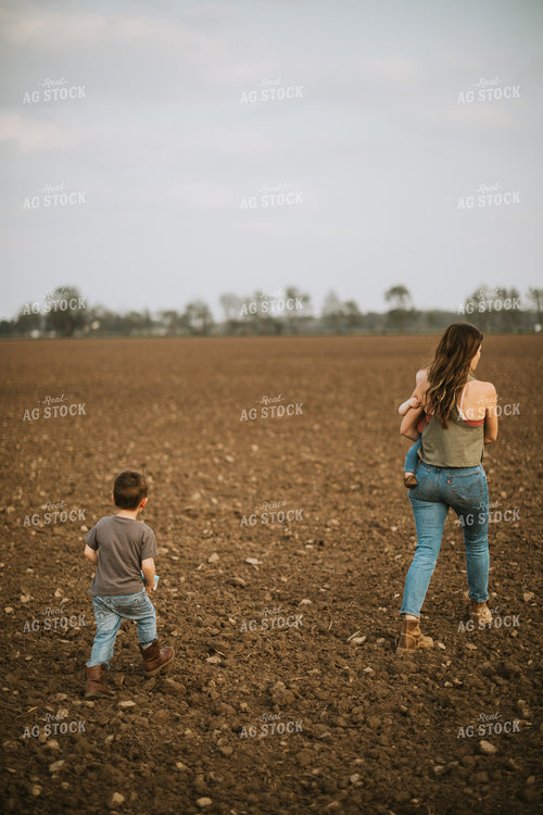 Farm Mom Taking Kids Out to Tractor During Planting 5633