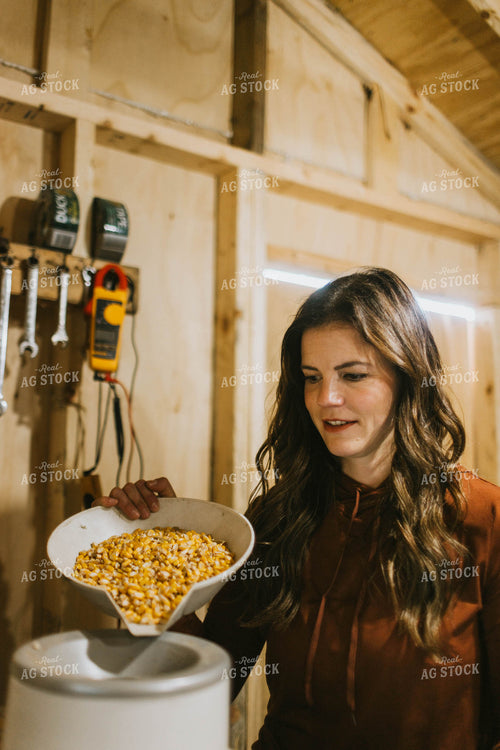 Female Farmer Testing Corn Moisture 8499