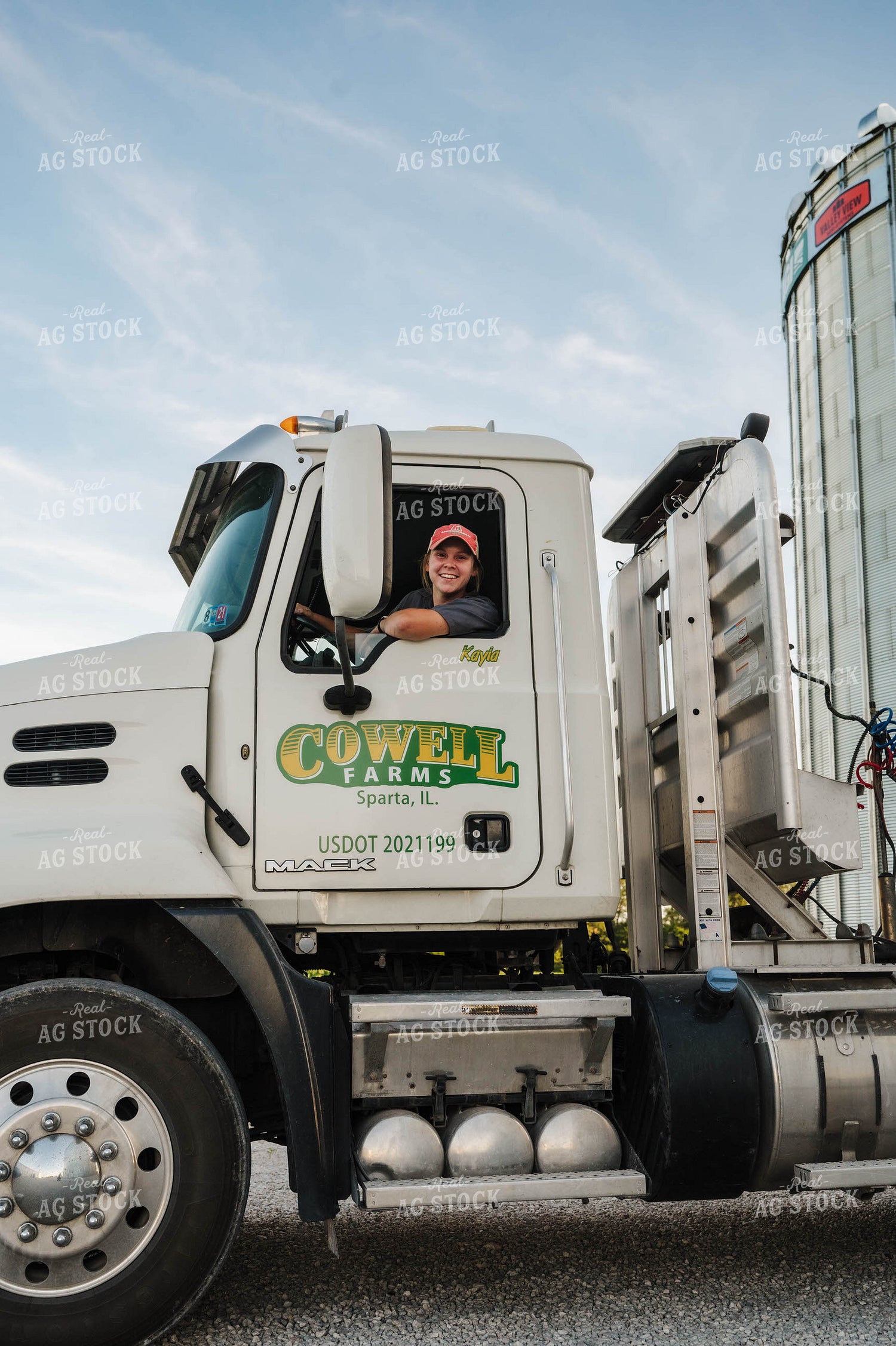 Female Farmer Driving Semi 115293