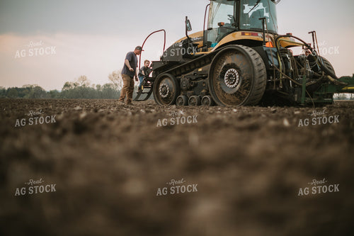 Farmer Walking Toward Planter Tractor with Farm Kid 5667