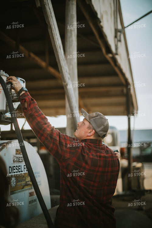 Farmer Fueling Tractor 6843
