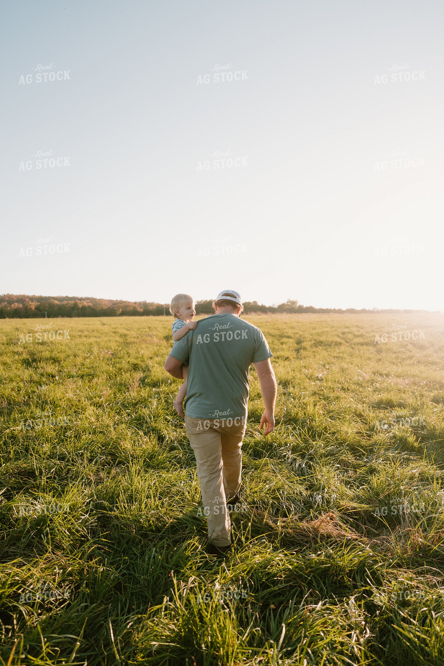 Farmer Checking Pasture with Farm Kid 125351