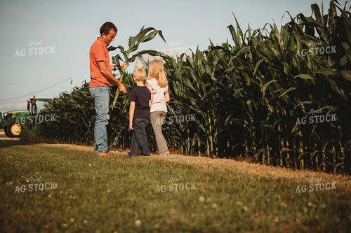 Farmer and Farm Kids Checking Corn Crop 4500