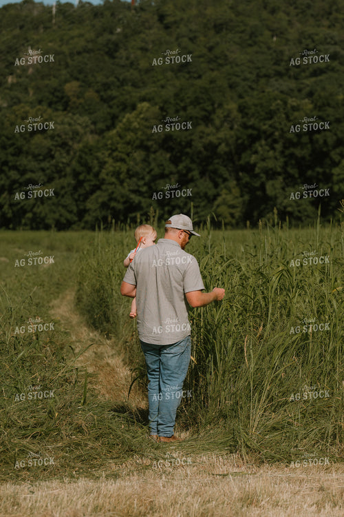 Farmer Checking Crops with Farm Kid 125400