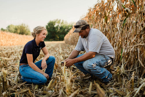 Farmer and Agronomist Using Phone in Field 8289