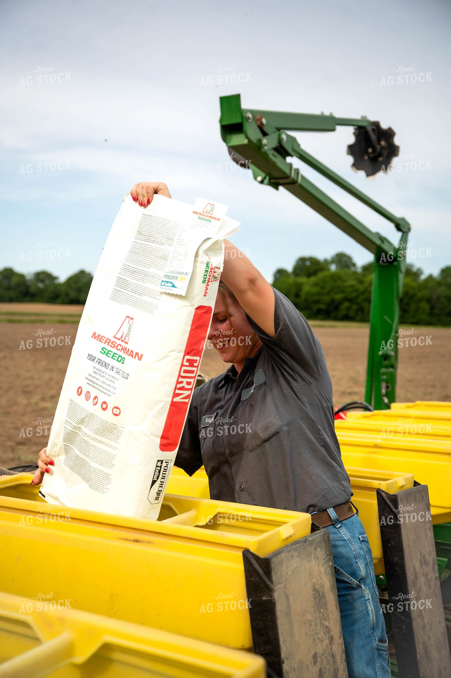Female Farmer Filling Planter 115633