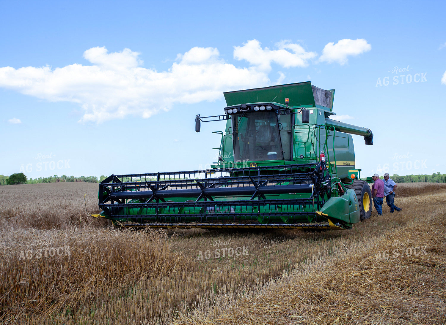 Farmers Talking by Equipment During Wheat Harvest 132070
