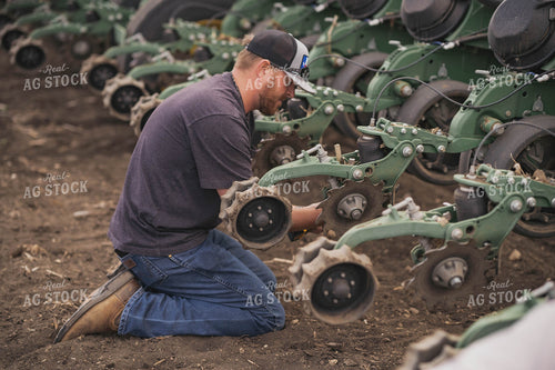Farmer Repairing Planter 91007