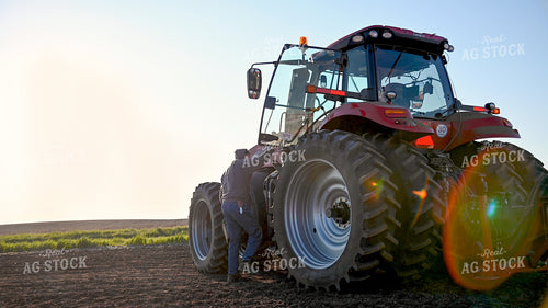 Farmer Climbing into Cab 25016