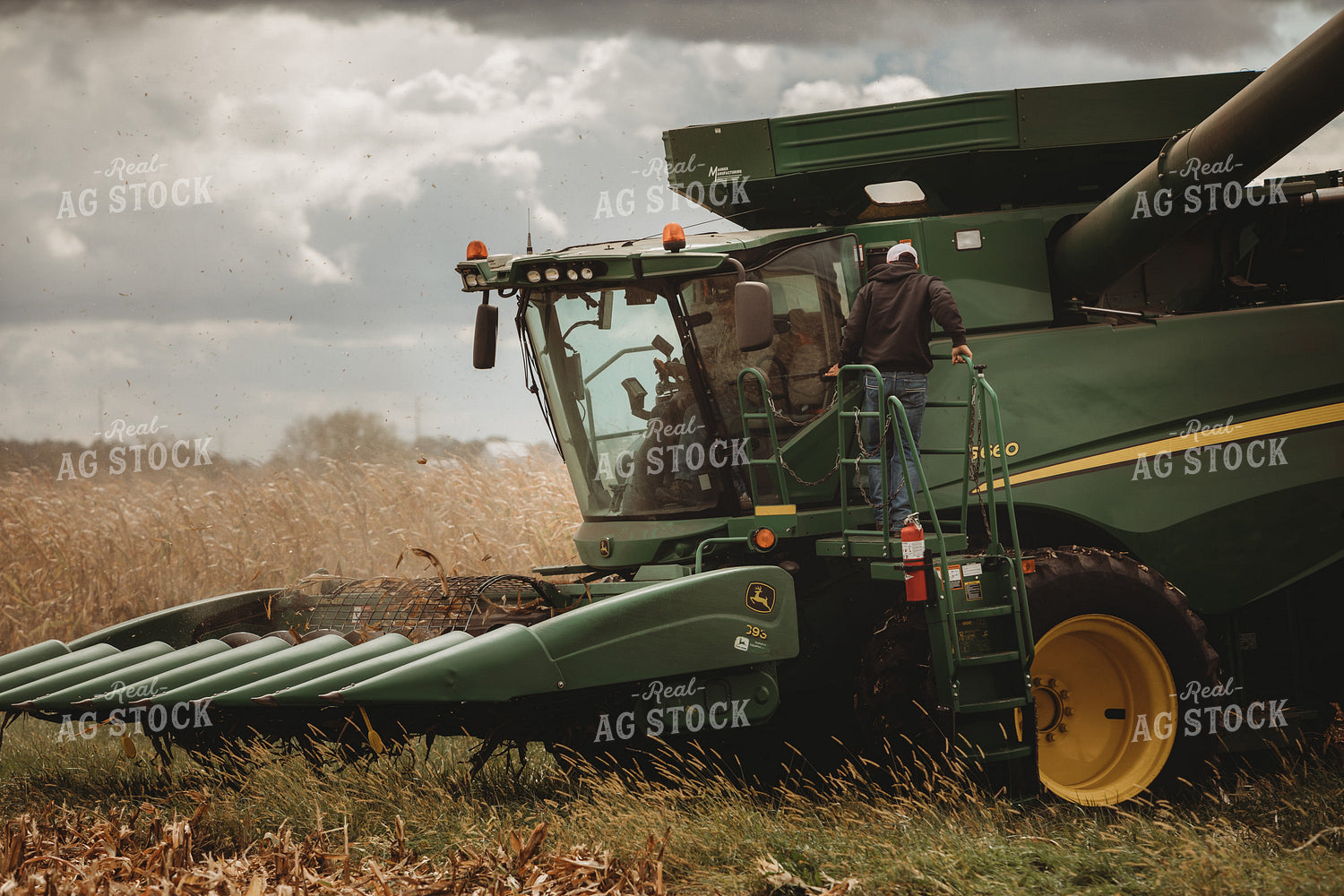 Salesman Climbing into Combine with Farmer 3346