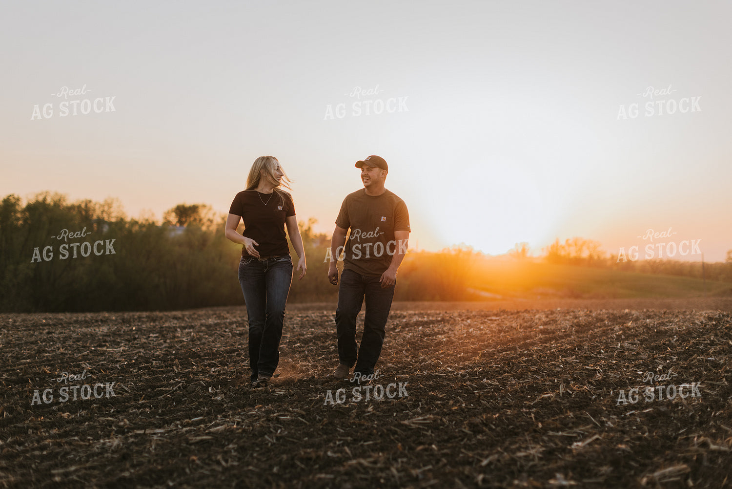 Young Couple Walk in Field at Sunset 7726