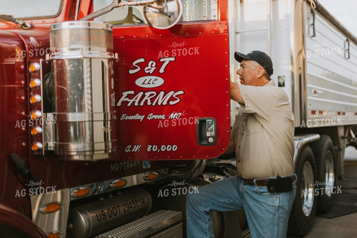 Farmer Climbing Into Semi Truck 7791