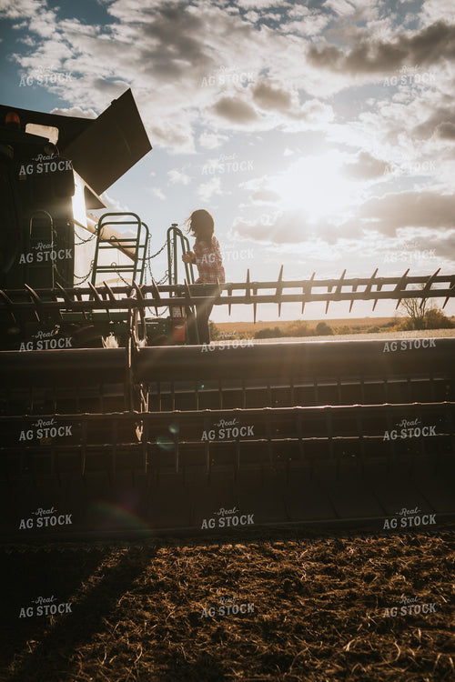 Female Farmer Getting into Combine 3524