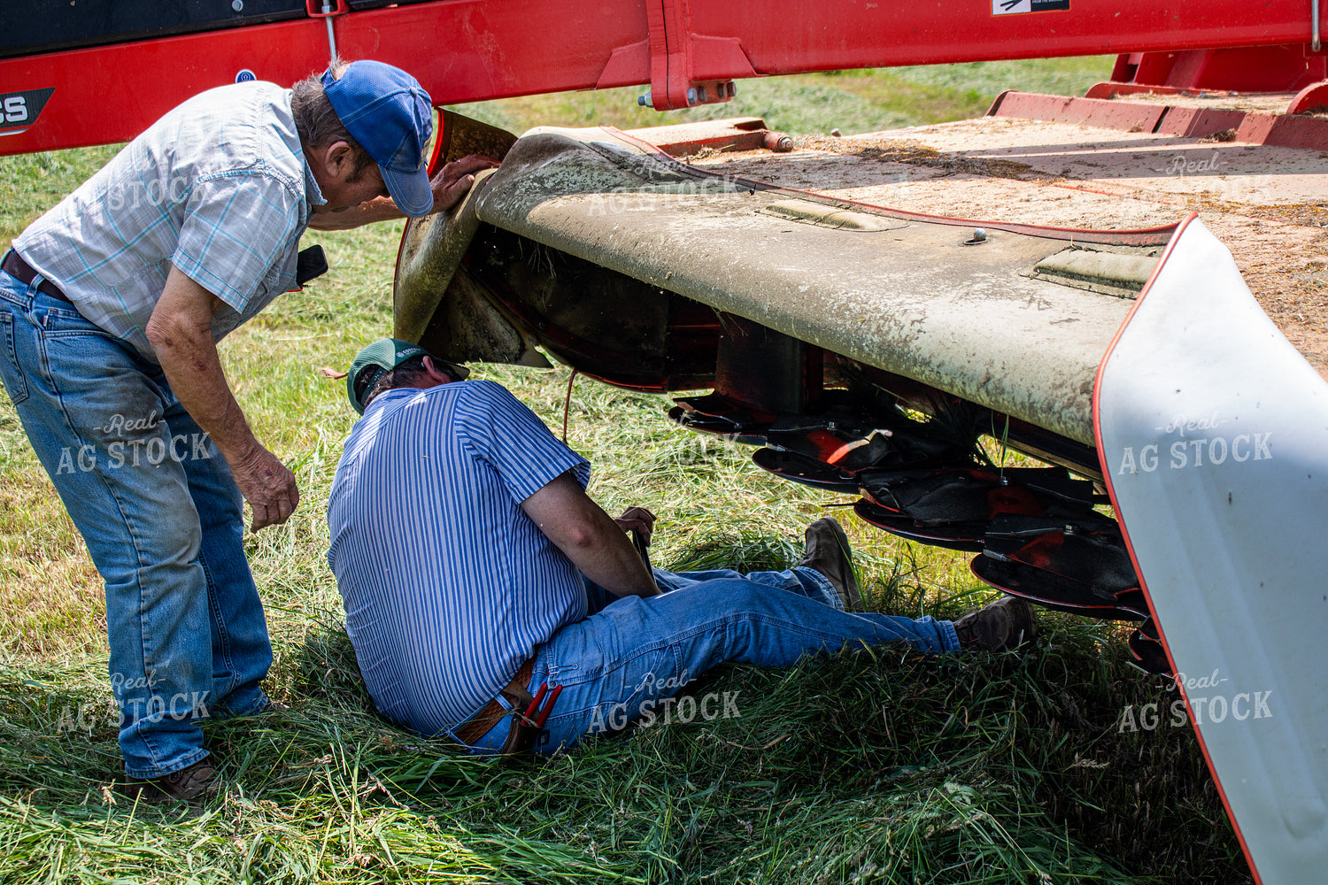 Farmers Fixing Hay Cutter 214139