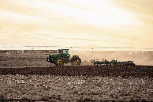Large Tractor Plowing Field on a Dusty Spring Day 152476