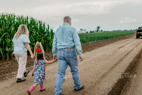 Farmers and Farm Kids Walking on Gravel Road 218067